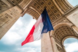 The flag of france at the arc de triomphe monument during bastille day